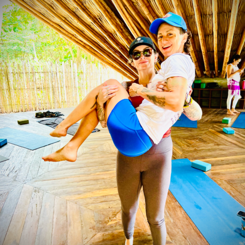 Koltie picks up Caro like a baby after practice in the shala. Chandra Vida Retreats.