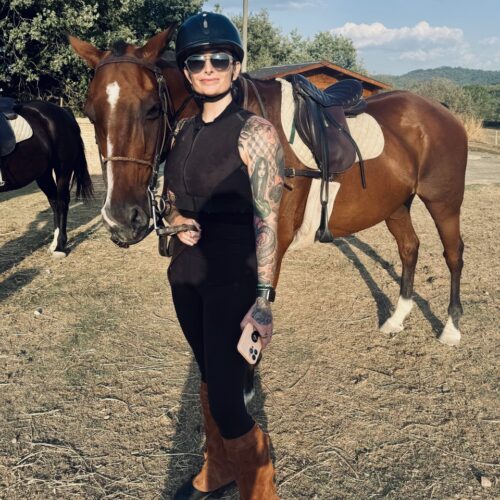 A pre-ride picture with Koltie and Bingo the horse at the Polo club in tuscany. Chandra Vida Retreats.