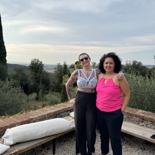 Koltie and Alexa pose for the last dinner at Ebbio with a beautiful sunset in the background. Chandra Vida retreats.